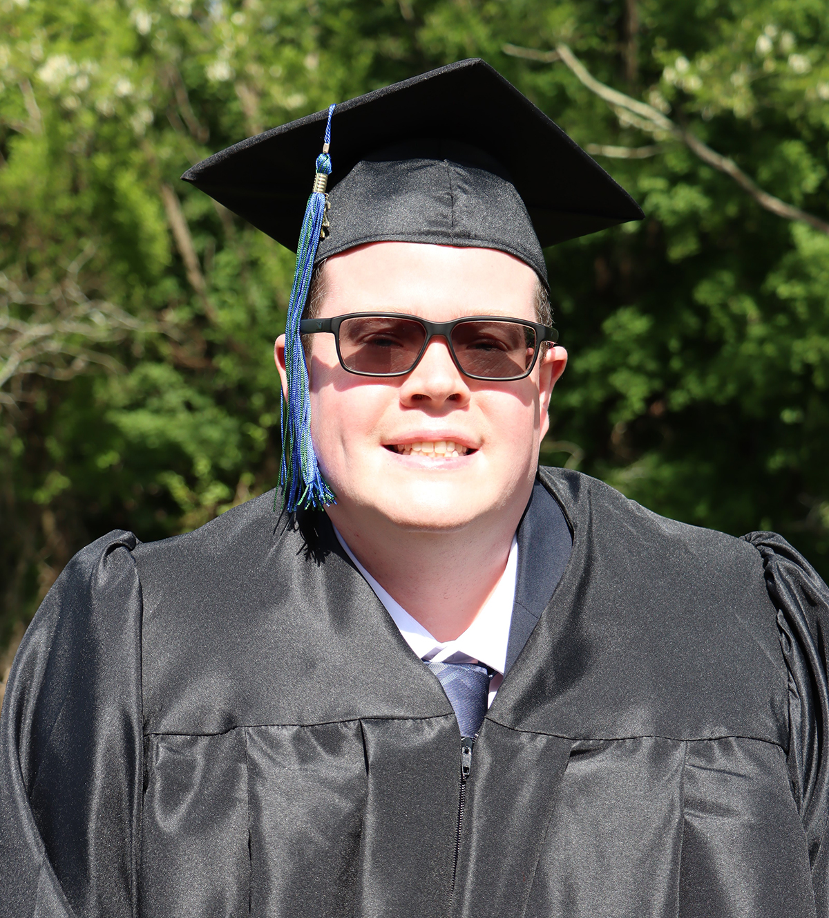 Keith in graduation cap and gown