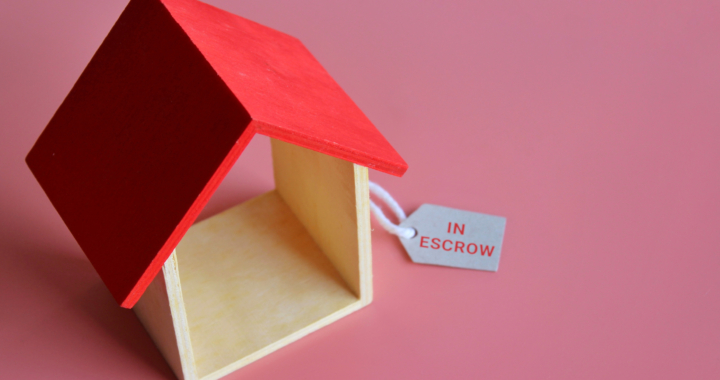 wooden house with a escrow tag